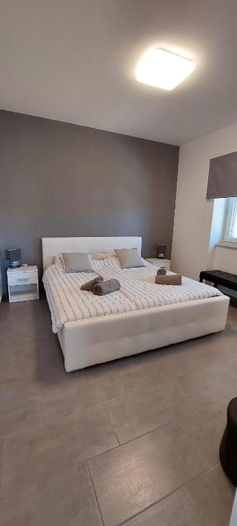 Кровать или кровати в номере Apartment "MANNA