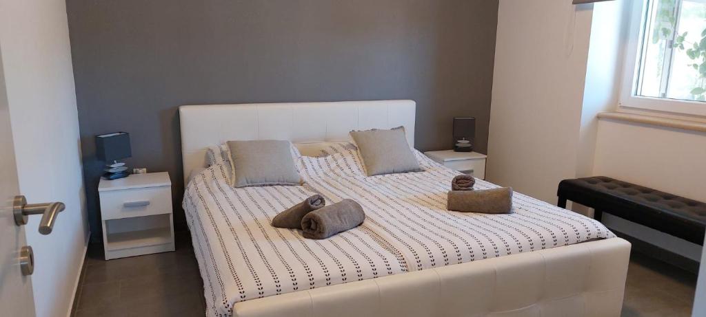 Кровать или кровати в номере Apartment "MANNA