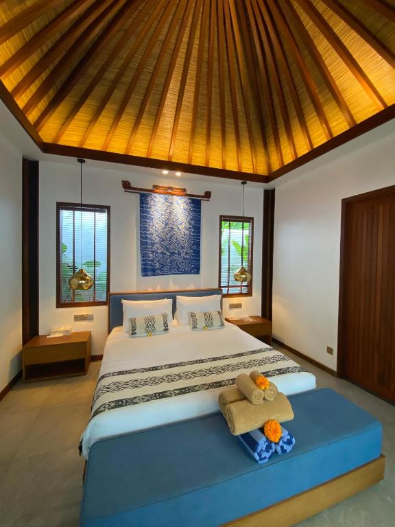 Postel nebo postele na pokoji v ubytování The Peacock Room Ubud