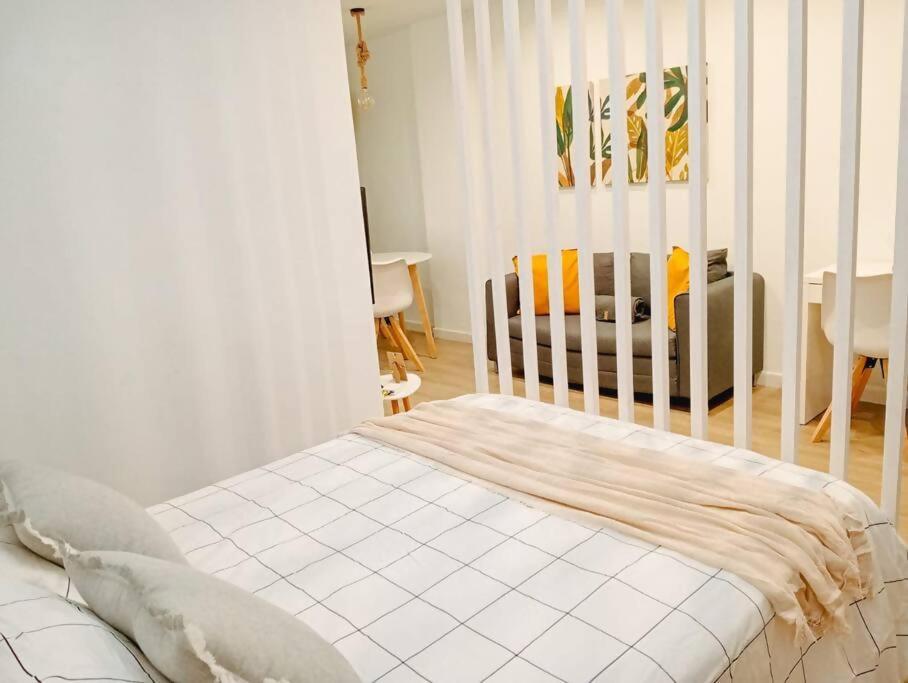 Posteľ alebo postele v izbe v ubytovaní Nomad, Wifi , Espacio trabajo ,Playa ,Ocio