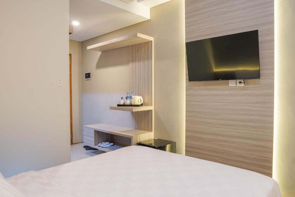 Voodi või voodid majutusasutuse Sajiwa Inn and Suite Hotel toas
