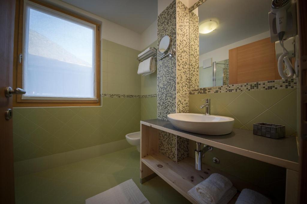 Koupelna v ubytování Aparthotel Dolomites Living&Relax
