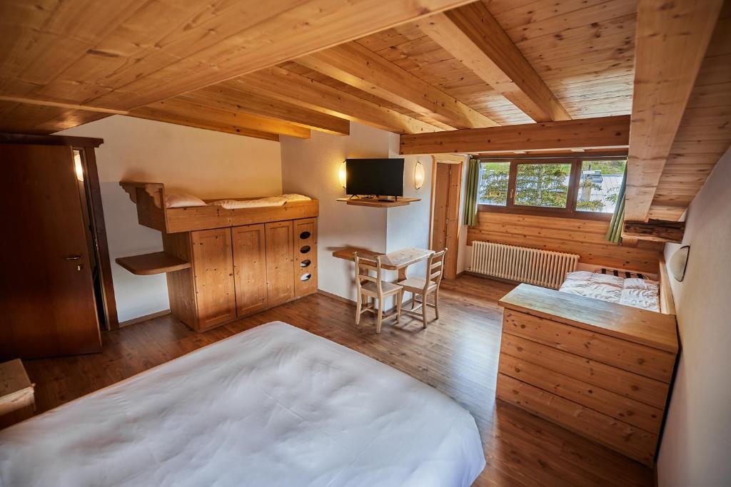 Postel nebo postele na pokoji v ubytování Hotel Vallechiara