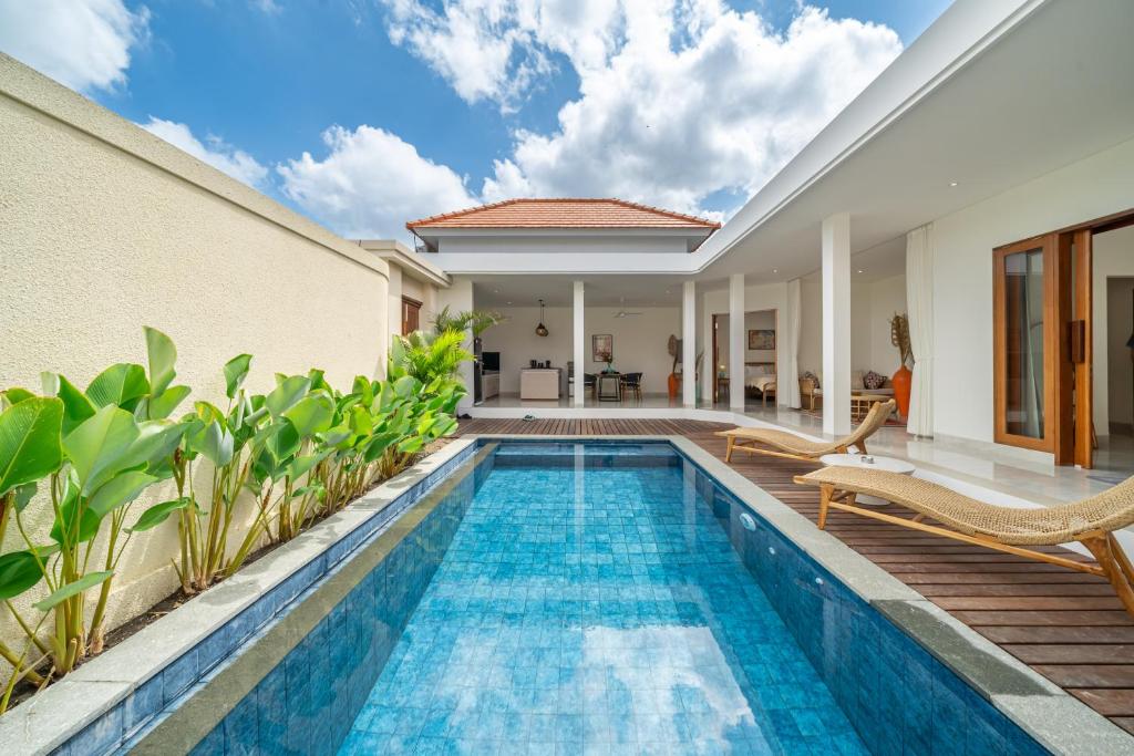 an image of a swimming pool in a villa at Kubung 2 - NEW listing Promo - Canggu - Big Pool and Kitchen in Kerobokan