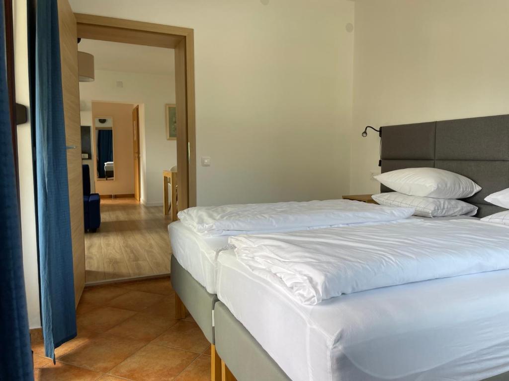 Postel nebo postele na pokoji v ubytování All Seasons Apartments Laško