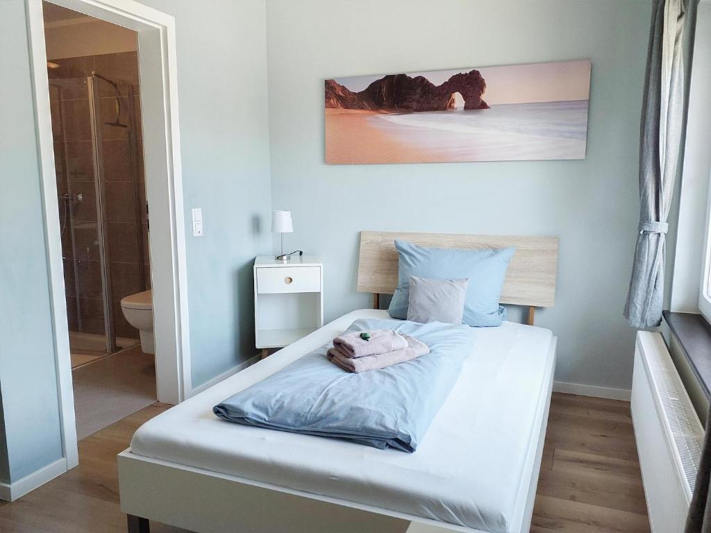 Postel nebo postele na pokoji v ubytování triple a³
