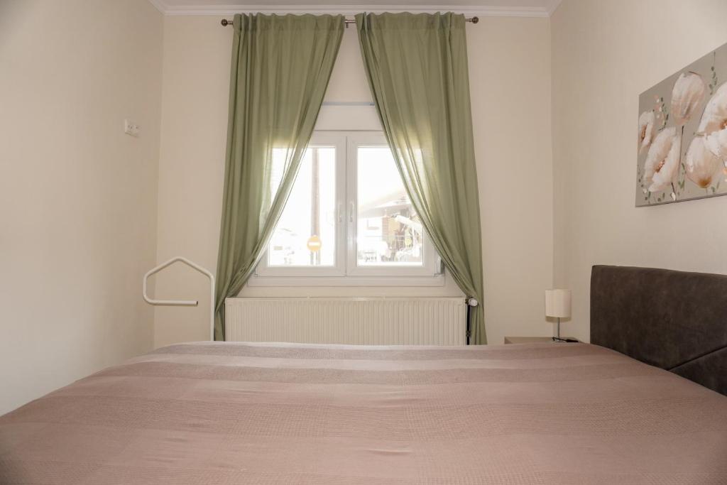 Postel nebo postele na pokoji v ubytování Filios Apartment