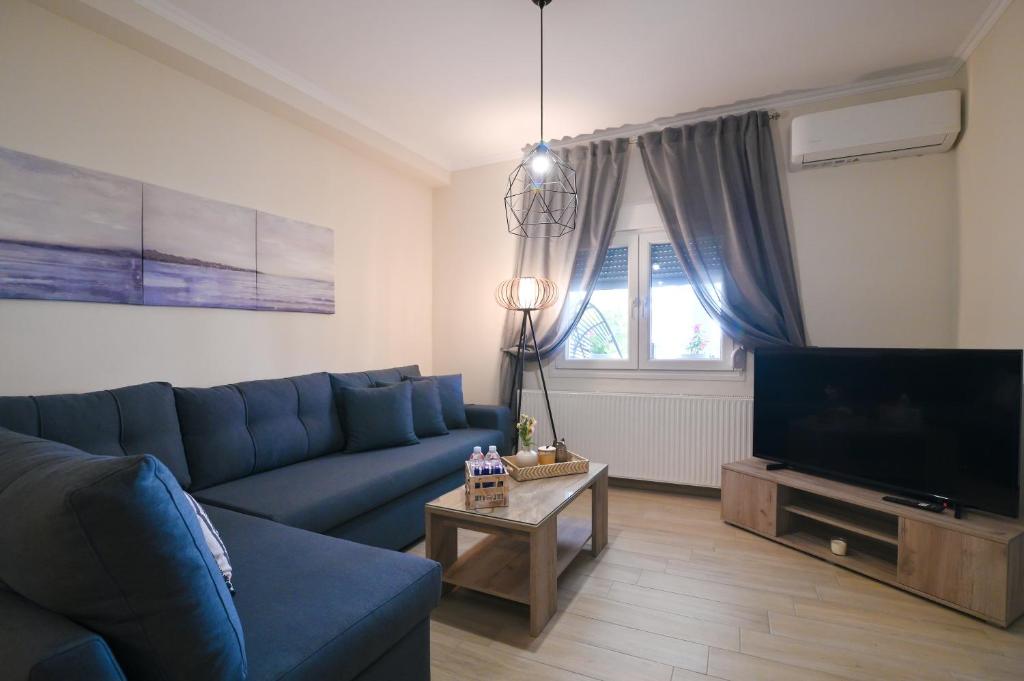 TV a/nebo společenská místnost v ubytování Filios Apartment