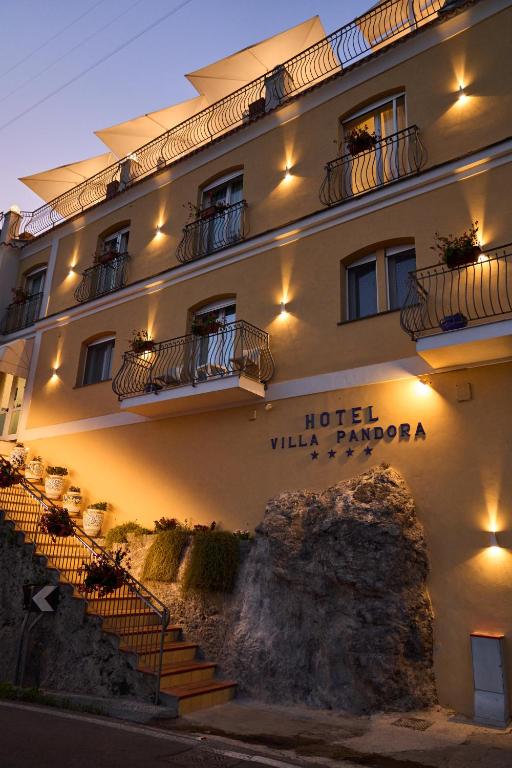 a hotel with stairs in front of a building at Hotel Villa Pandora in Maiori