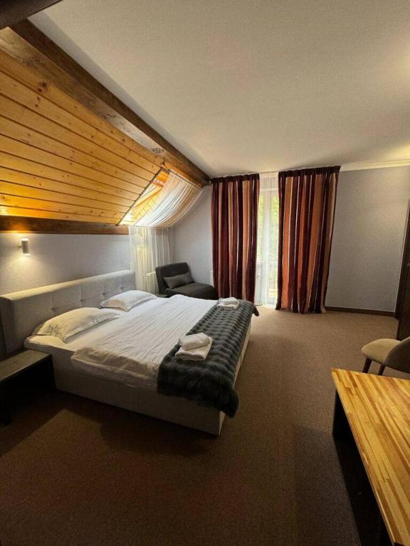 Postel nebo postele na pokoji v ubytování Wellland Hotel