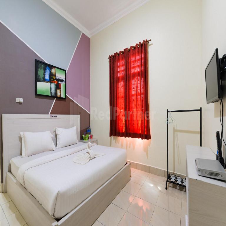 TV a/nebo společenská místnost v ubytování Hotel 78 Parapat Mitra RedDoorz