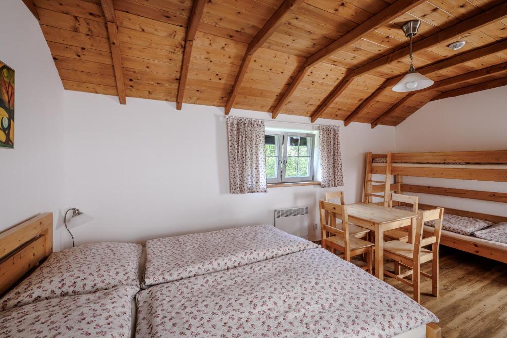 Postel nebo postele na pokoji v ubytování Resort Vysoká Lípa