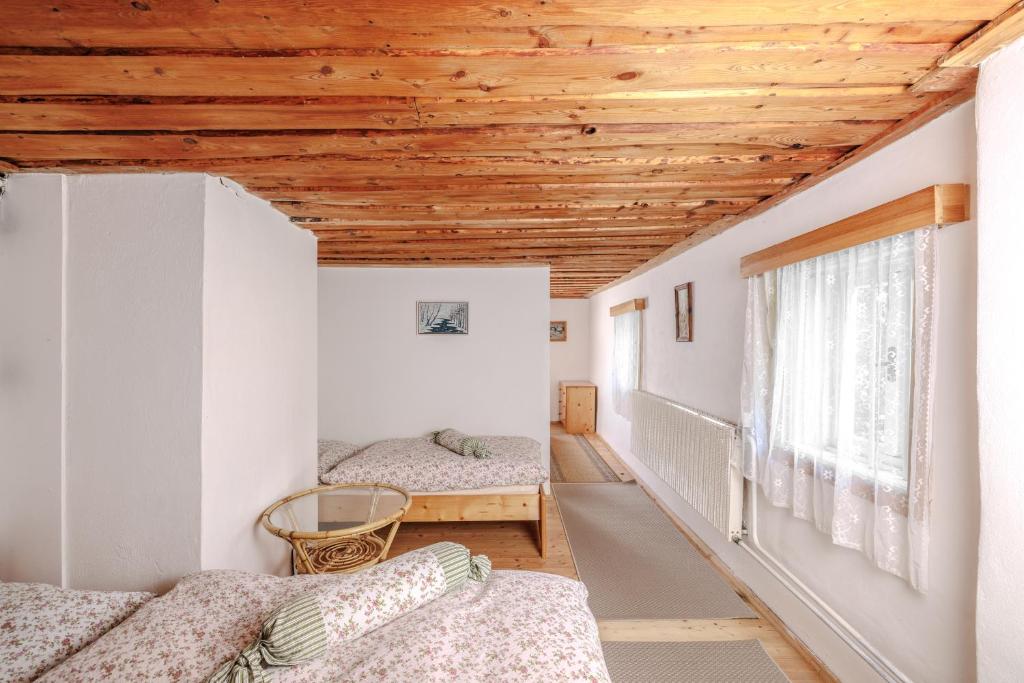 Postel nebo postele na pokoji v ubytování Resort Vysoká Lípa