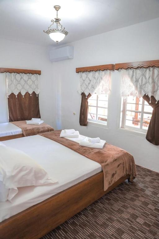 Postel nebo postele na pokoji v ubytování Guesthouse Gogu