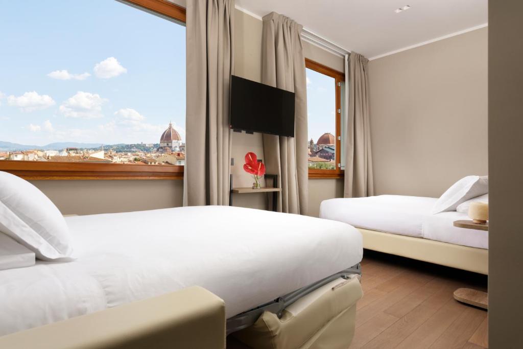 Postel nebo postele na pokoji v ubytování Essence Hotel