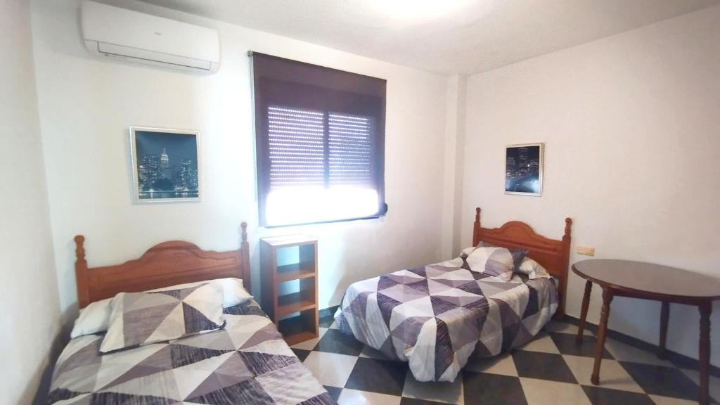 Postel nebo postele na pokoji v ubytování Piso Palomino