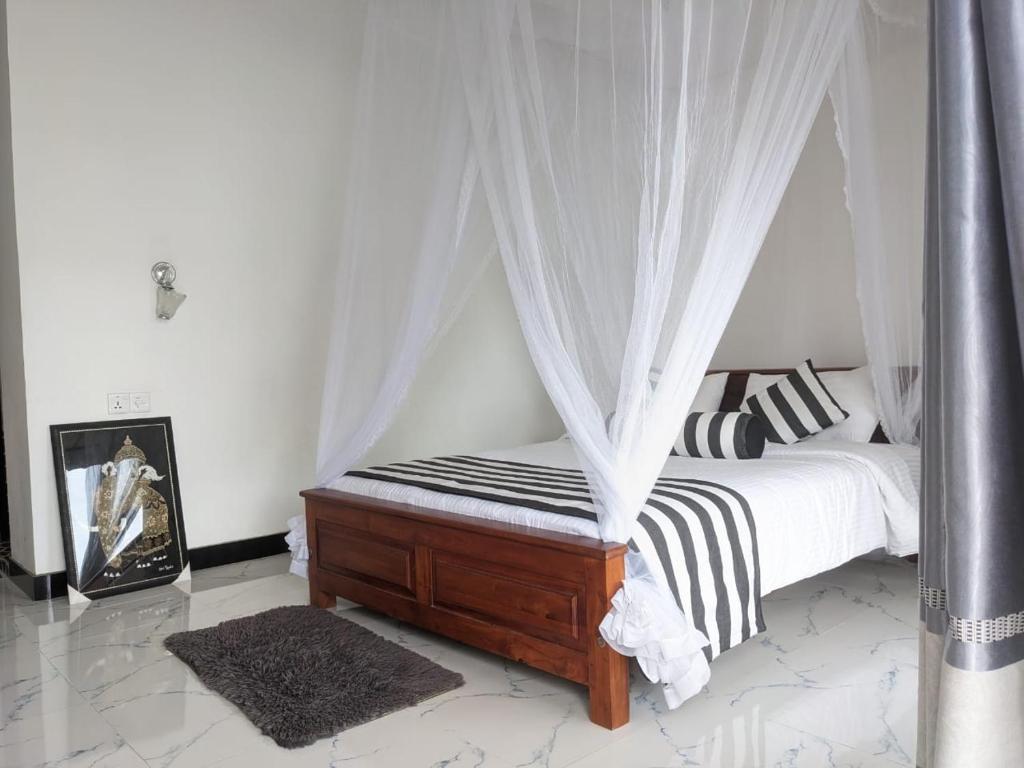 Postel nebo postele na pokoji v ubytování Baagie Homestay