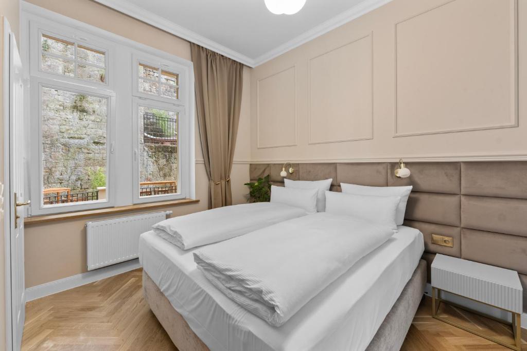 Postel nebo postele na pokoji v ubytování Residenz Hugo