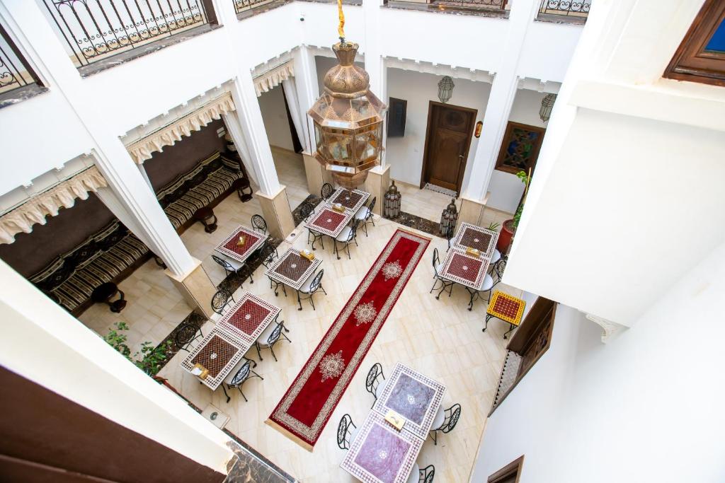 an overhead view of a lobby with tables and a chandelier at Riad Mandana & Spa in Marrakech