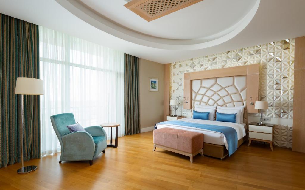 Postel nebo postele na pokoji v ubytování Badamdar Hotel and Residences