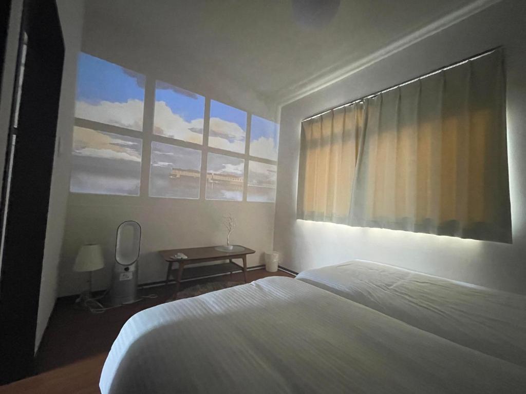 Letto o letti in una camera di THE MOON Atami