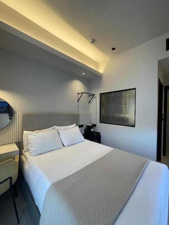 Posteľ alebo postele v izbe v ubytovaní Palladion Boutique Hotel