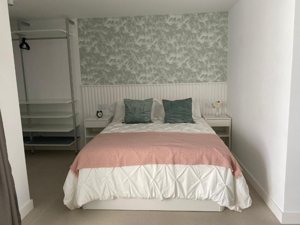 Postel nebo postele na pokoji v ubytování Descanso junto a las dunas