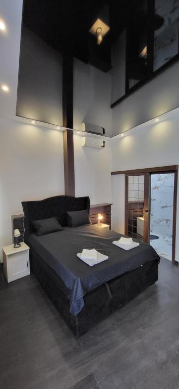 a bedroom with a large bed in a room at Bumerang Apartmans, New Belgrade, Belgrade Arena in Belgrade