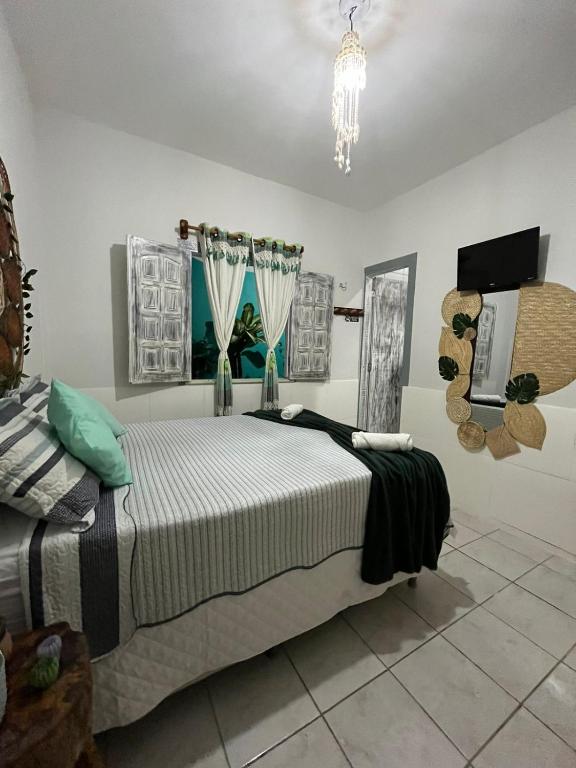 Postel nebo postele na pokoji v ubytování Hospedaria Mandacaru