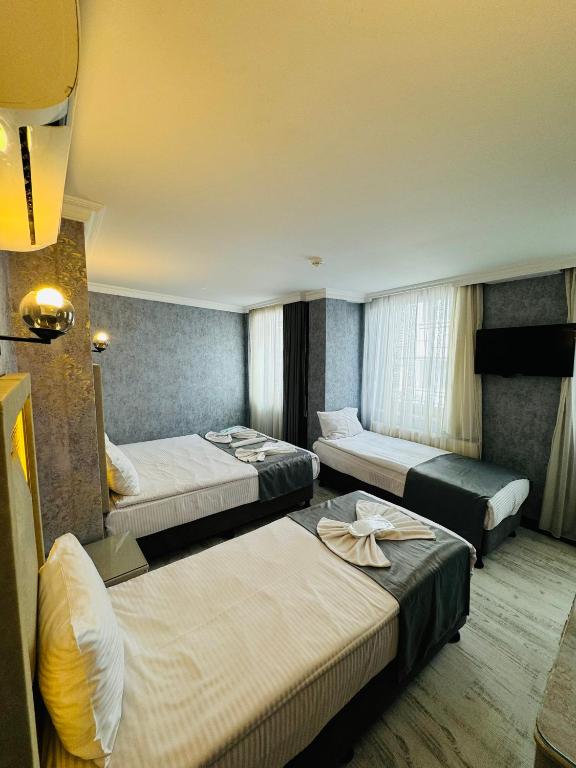 Postel nebo postele na pokoji v ubytování Old City Viva Hotel