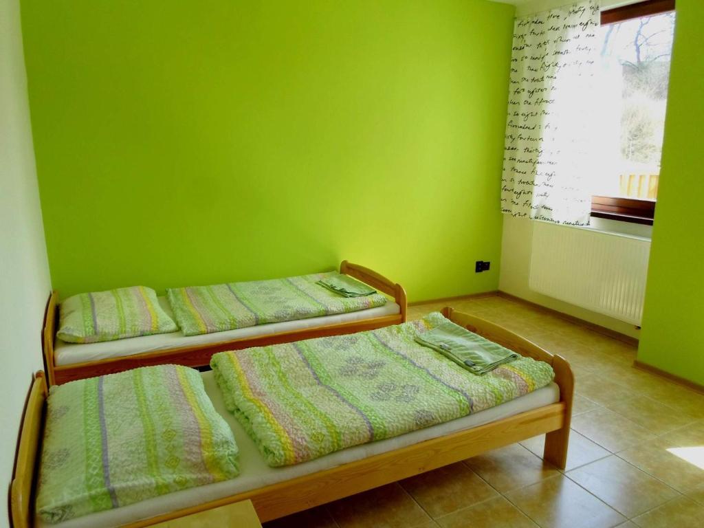 Postel nebo postele na pokoji v ubytování Penzion Na přehradě