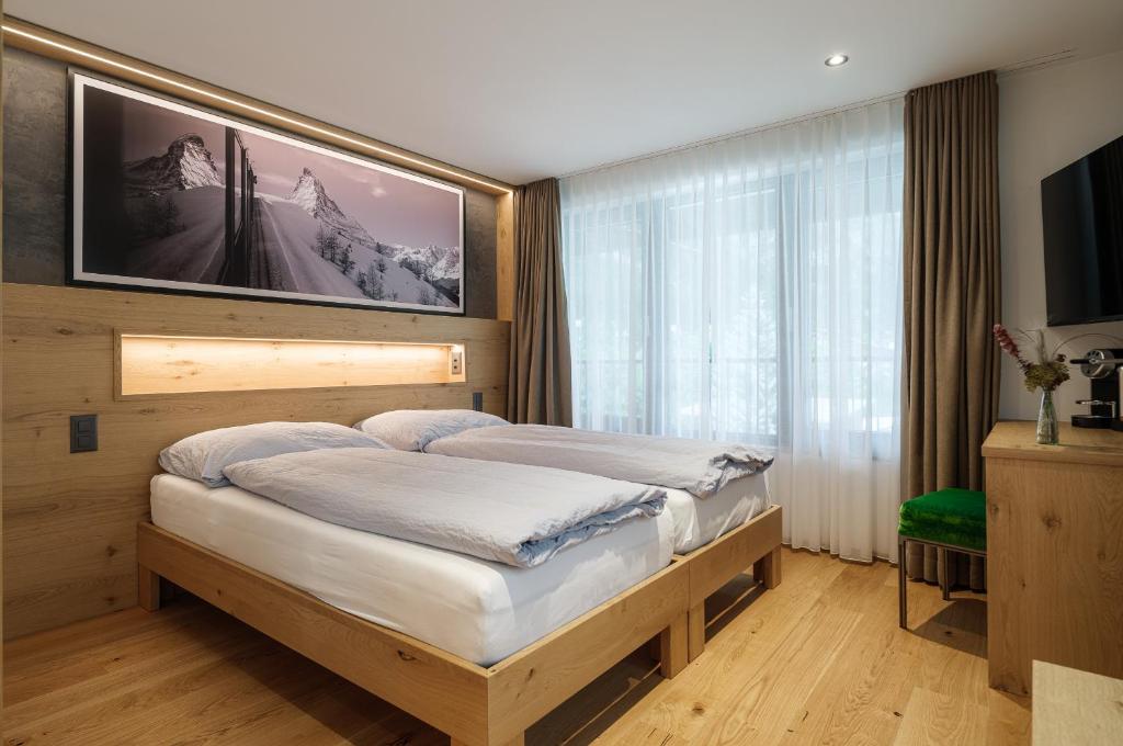 Postel nebo postele na pokoji v ubytování Hotel La Reserve