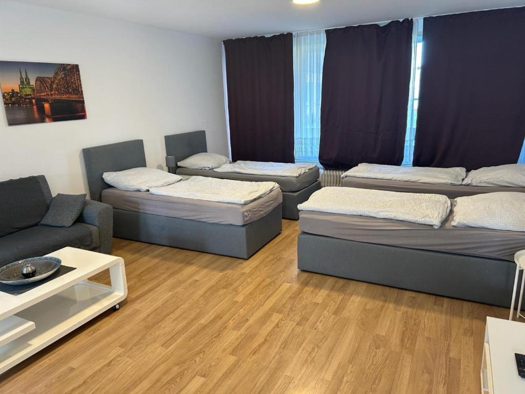 Ένα ή περισσότερα κρεβάτια σε δωμάτιο στο Wohnung in Troisdorf T02