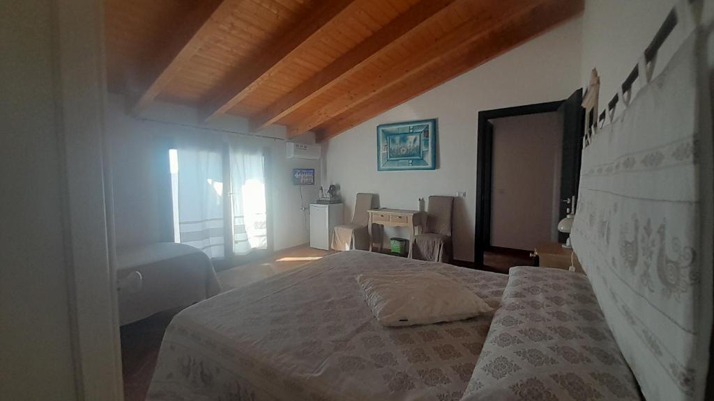 Postel nebo postele na pokoji v ubytování B&B Nuovo Capo Altano