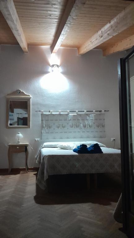 Postel nebo postele na pokoji v ubytování B&B Nuovo Capo Altano