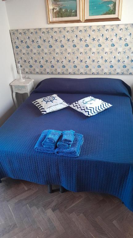 Postel nebo postele na pokoji v ubytování B&B Nuovo Capo Altano