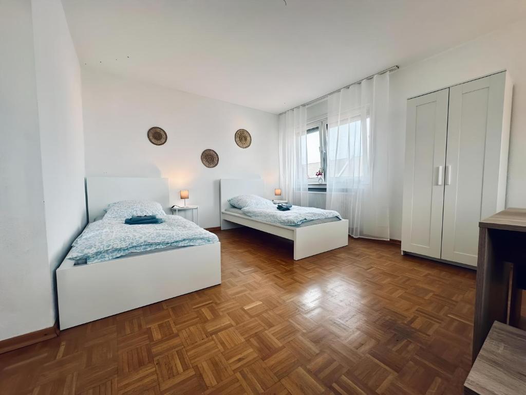 Ένα ή περισσότερα κρεβάτια σε δωμάτιο στο sleepWELL-Steinfurt Zentrum Borghorst