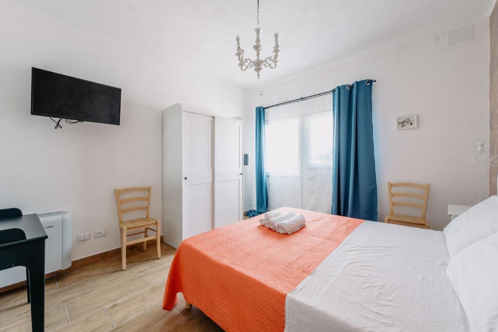 Postel nebo postele na pokoji v ubytování Franciacorta Rooms