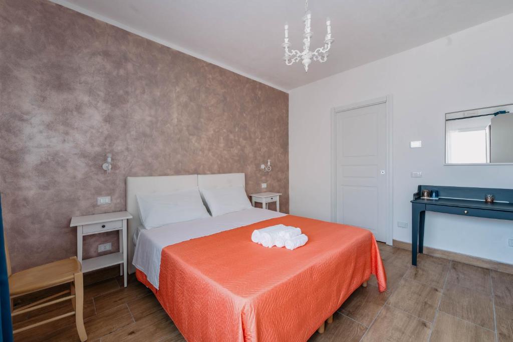 Postel nebo postele na pokoji v ubytování Franciacorta Rooms