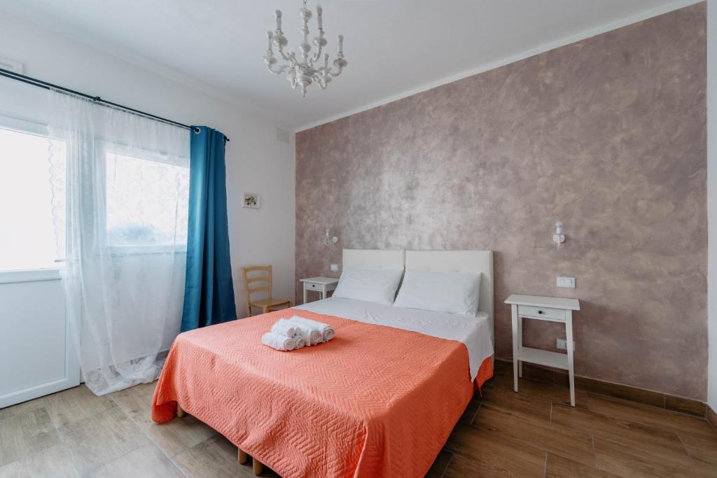 Postel nebo postele na pokoji v ubytování Franciacorta Rooms