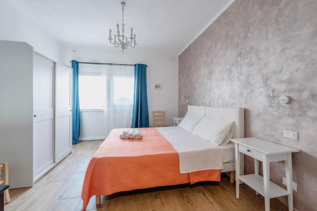 Postel nebo postele na pokoji v ubytování Franciacorta Rooms