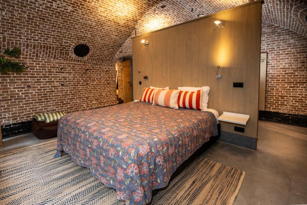 Postel nebo postele na pokoji v ubytování Fort Vuren