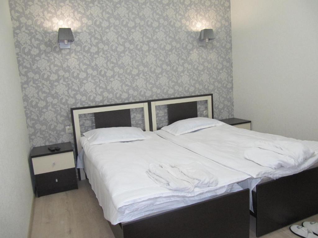 Postel nebo postele na pokoji v ubytování Guest House Imereti