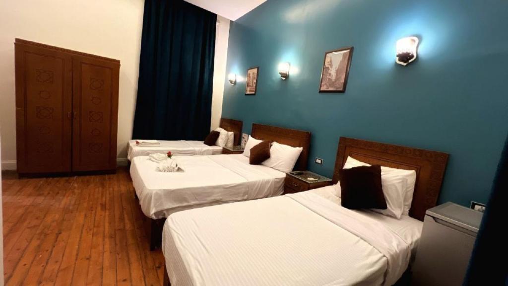 A bed or beds in a room at Minerva Grand Boutique