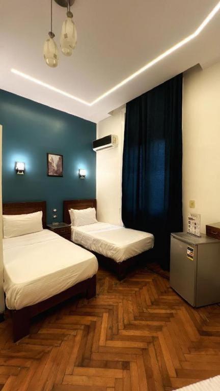 A bed or beds in a room at Minerva Grand Boutique