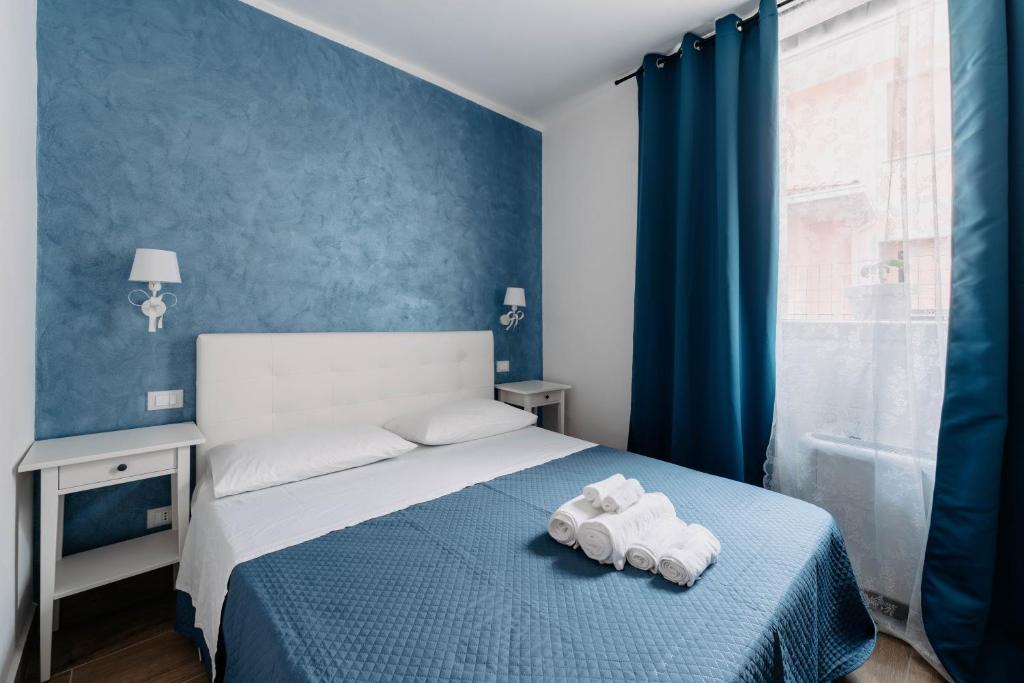 Postel nebo postele na pokoji v ubytování Franciacorta Rooms