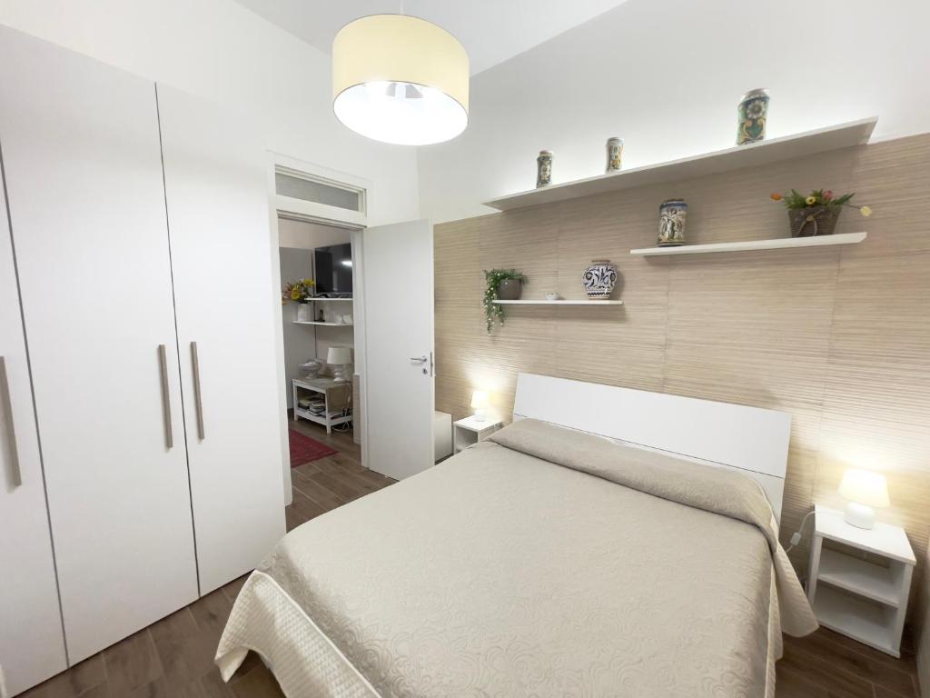 A bed or beds in a room at CATHEDRAL APARTMENT
