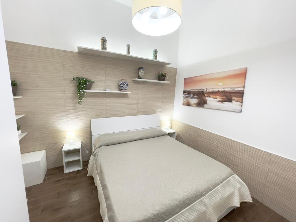 A bed or beds in a room at CATHEDRAL APARTMENT