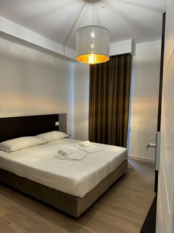 Postel nebo postele na pokoji v ubytování Hotel Airone