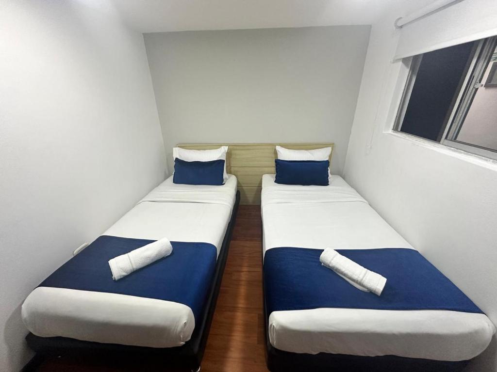 Postel nebo postele na pokoji v ubytování Hotel Embajada Bogota DC